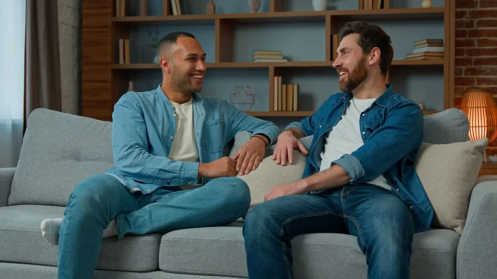 Same sex couple discussing family planning through surrogacy