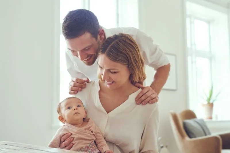 Intended parents with their baby following a California surrogacy journey