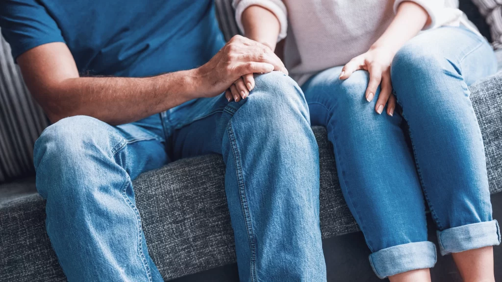 Intended parents supporting each other during their surrogacy journey after an unsuccessful embryo transfer